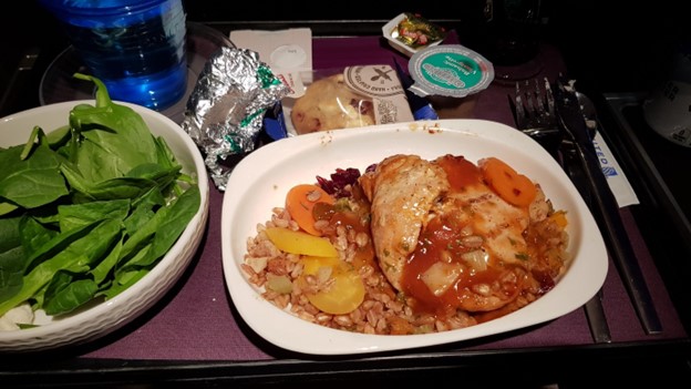 Chicken entree served on Premium Plus flight